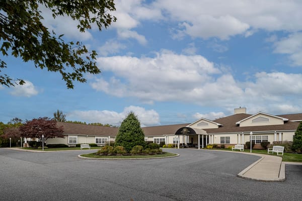 Exterior of Celebration Villa of York with trees and a circular driveway