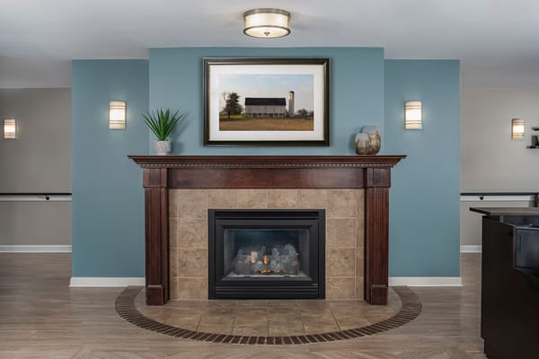 Cozy common area with fireplace and artwork