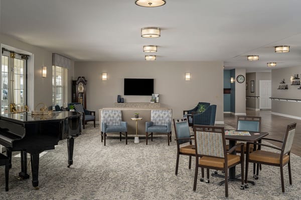 Interior common area with seating and a piano