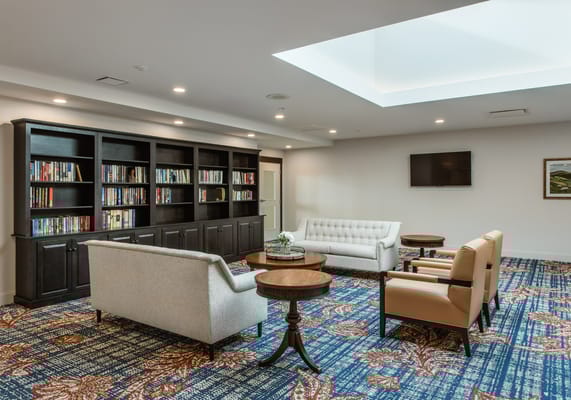 Bright and inviting common area with bookshelves