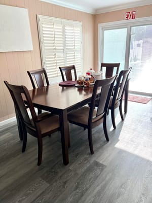 A well-set dining table in a bright room