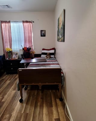 A cozy private resident room with a bed and decorations