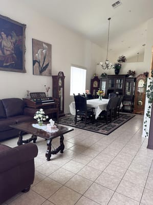 A cozy dining area with a long table set for meals.