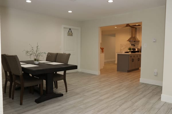 Dining table with chairs and kitchen view