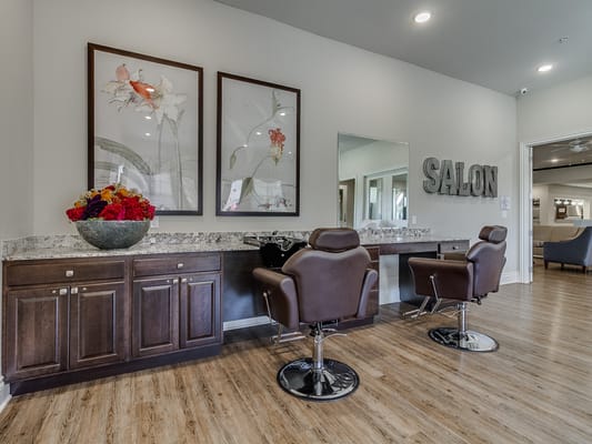 Interior view of a salon space with hair styling stations