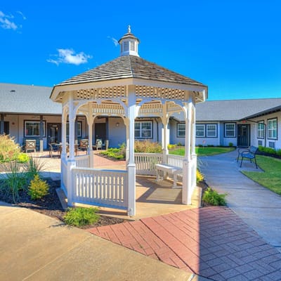 White gazebo in the courtyard of Iris Memory Care