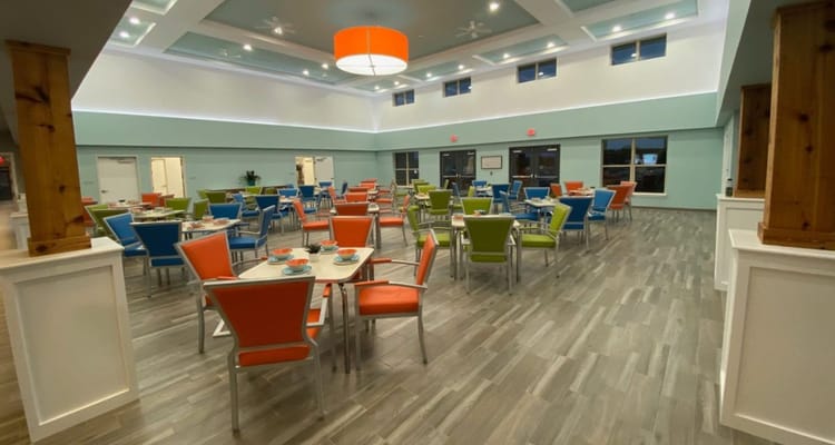 Bright and spacious dining room with colorful seating