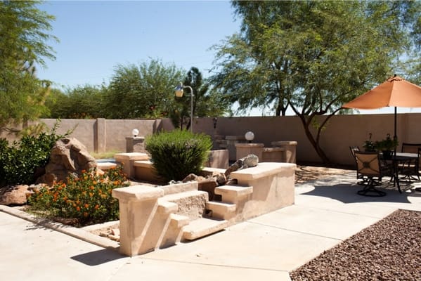 Peaceful outdoor space with seating and landscaping