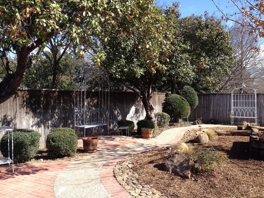 Serene outdoor garden path with seating