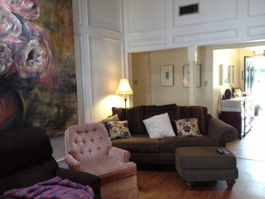 Bright sitting area with sofas and artwork