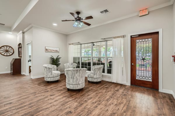 Bright and inviting common area with seating and windows