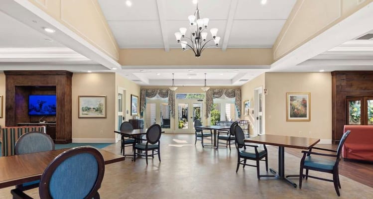 Bright common area with tables and chairs