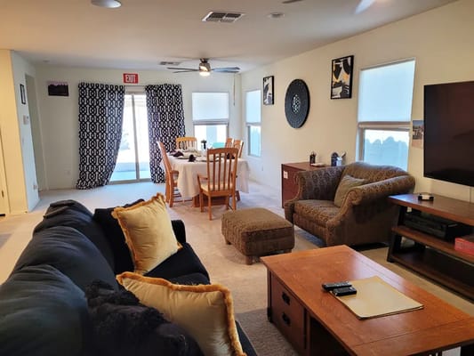 Bright common area with seating and dining space