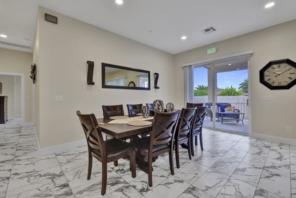 Dining table with chairs and outdoor view in Sun City Assisted Living