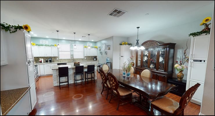 Bright dining area with wooden table and chairs