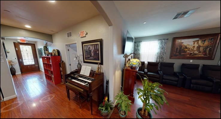 Interior view of a cozy common area with seating and decor