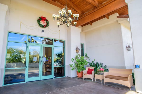 Entrance to the office with a wreath and seating area.