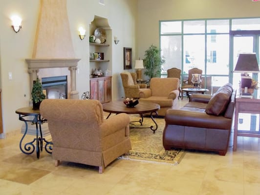 Lounge area with comfortable seating and a fireplace