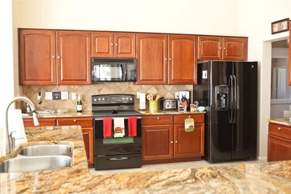 Modern kitchen with wood cabinets and appliances
