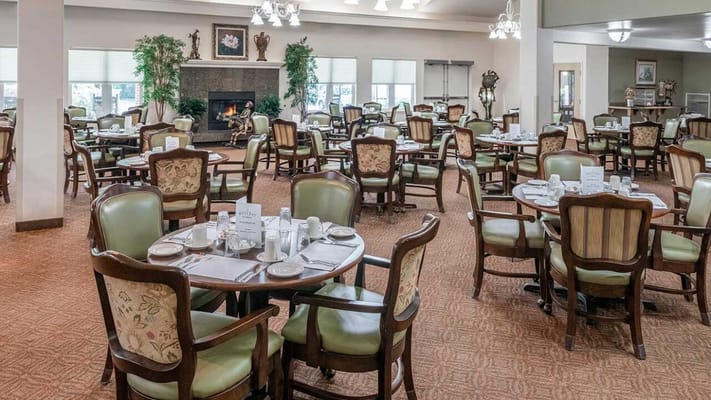 Bright dining room with tables set for meals