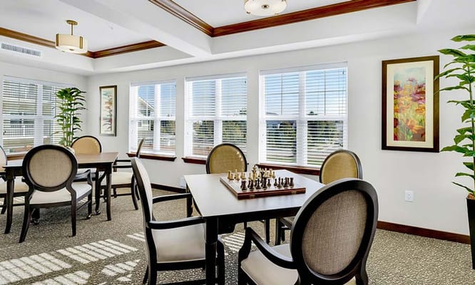 Bright and welcoming chess room with tables and chairs