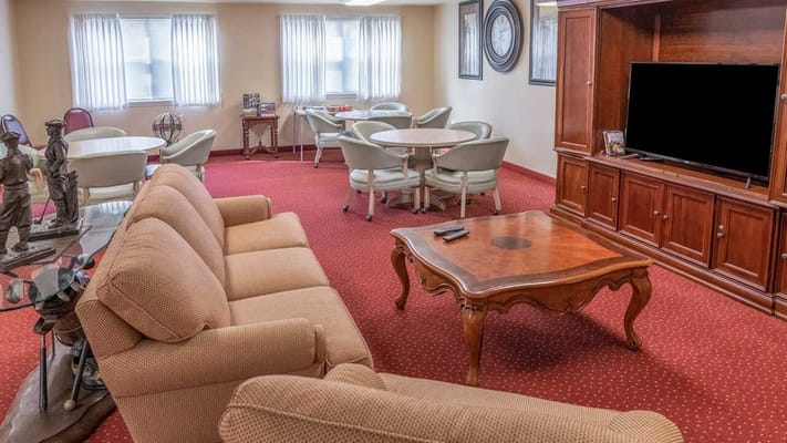 Cozy common area featuring seating and dining tables.