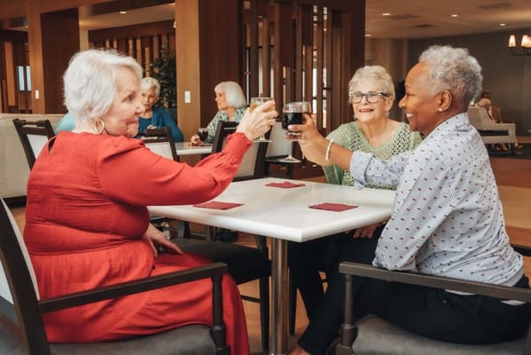 Residents toasting in a bright common area
