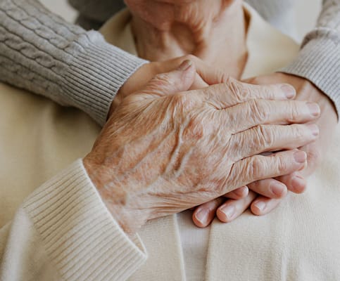 Close-up of hands showing care and support