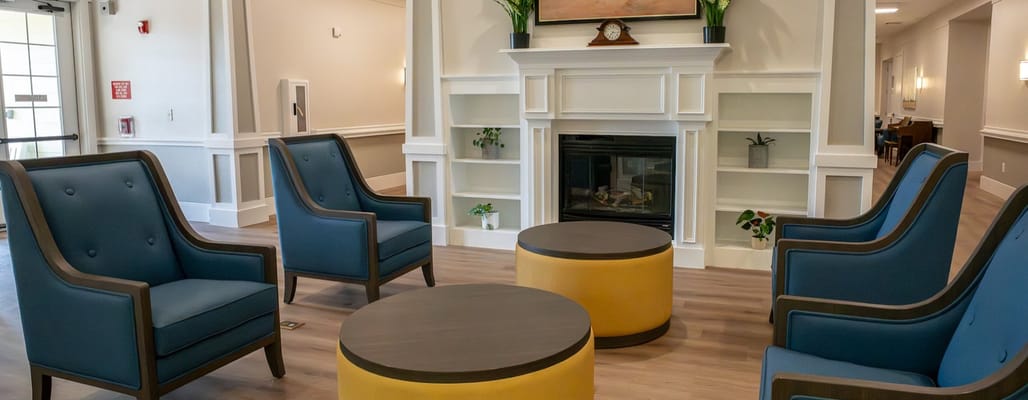 Bright common area with seating around a coffee table