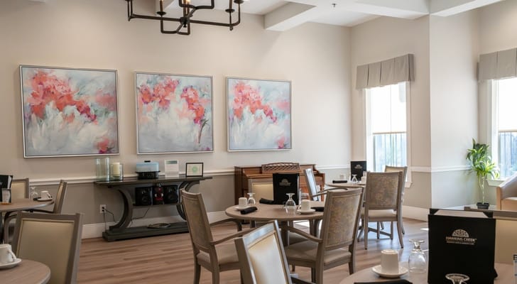 Bright dining room with artistic decor and dining settings