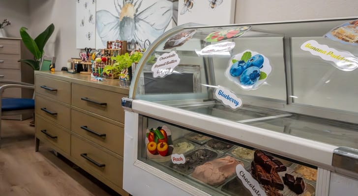 Interior view of a dessert display with ice cream flavors