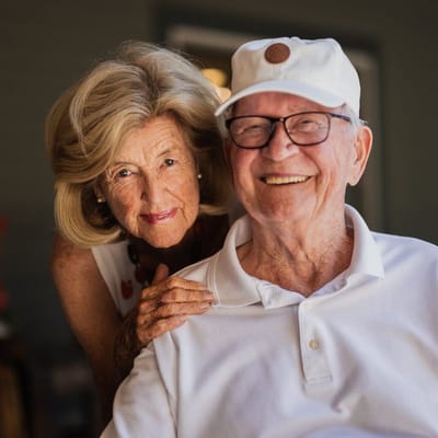 Happy senior residents posing together outdoors