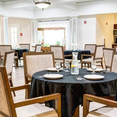 Bright dining room with tables set for a meal