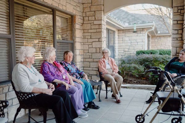 Residents enjoying time outdoors in a communal area