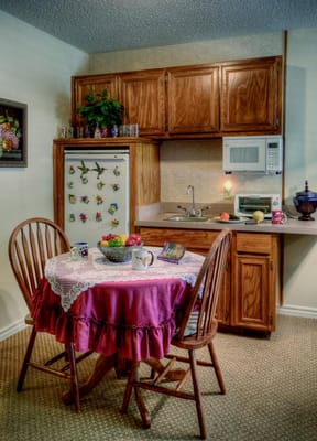 Cozy kitchenette with a table and fruit bowl