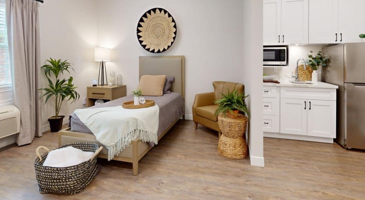 Well-furnished resident room showcasing a cozy atmosphere