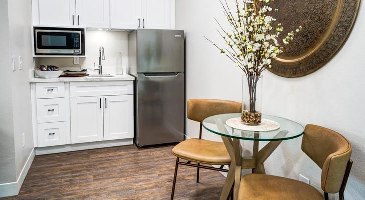 Cozy kitchenette with dining table and chairs