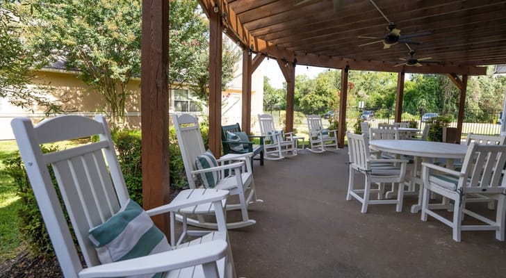 Outdoor seating area with rocking chairs