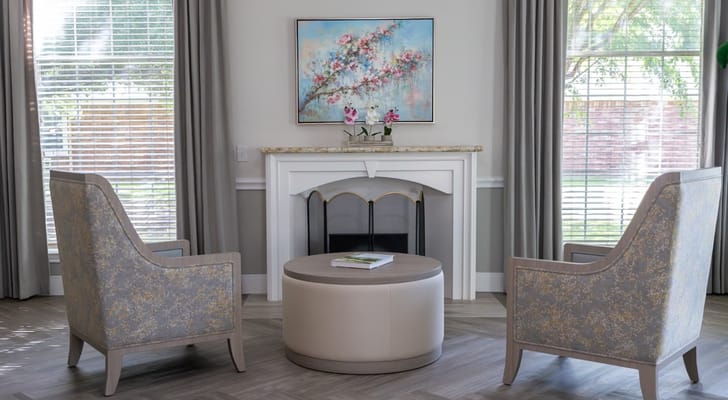 Interior common area with two chairs and a coffee table