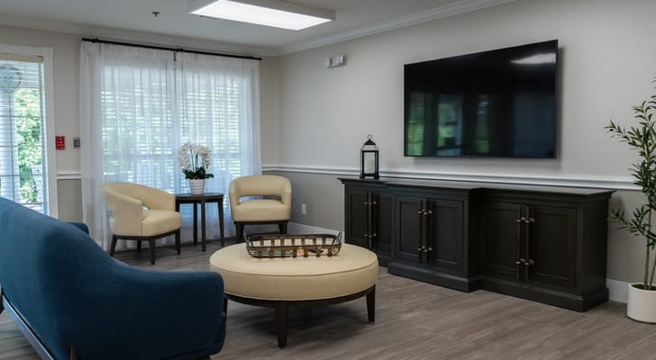 Bright common area with seating and TV