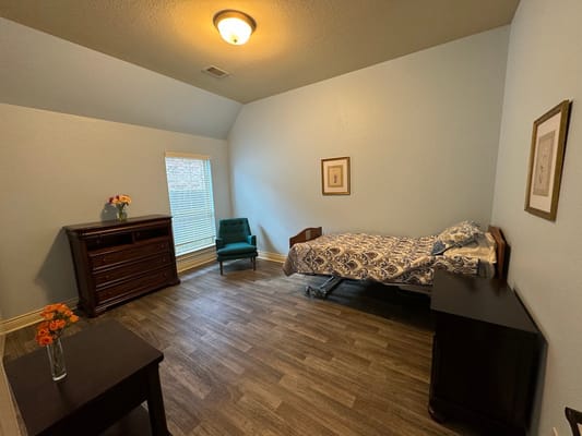 A well-furnished private resident room with natural light