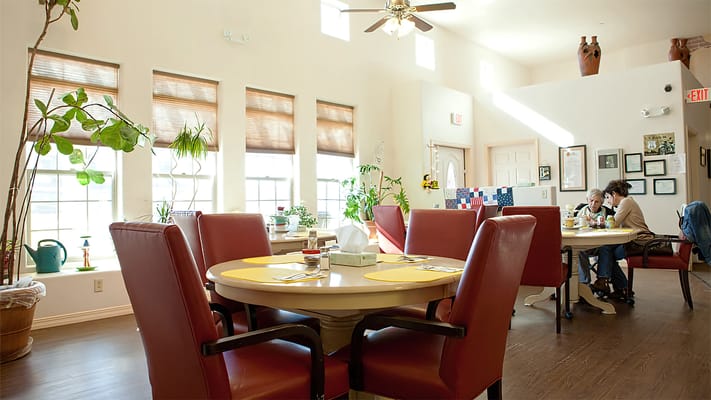 Bright dining area with residents enjoying meals