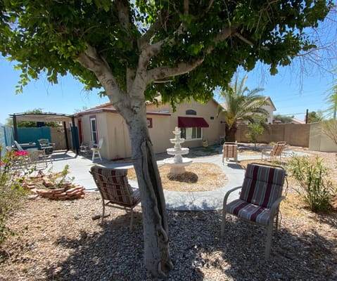 Quiet outdoor space with seating and a fountain