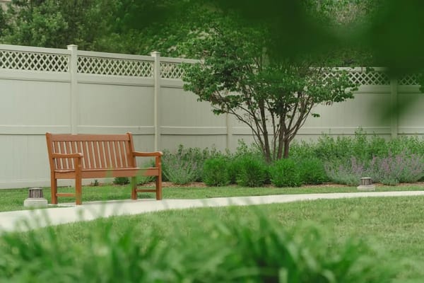 A peaceful garden bench in a landscaped area