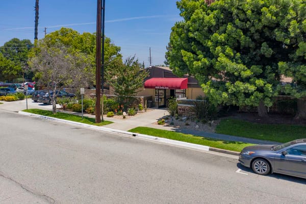 Exterior view of Mission Care Center's entrance and landscaping