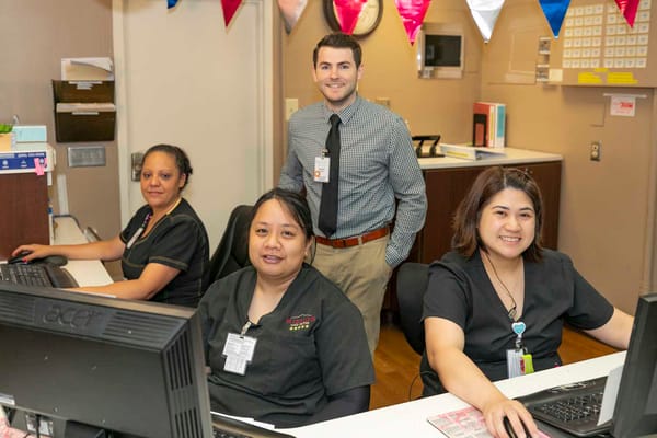 Staff members at reception in a nursing facility