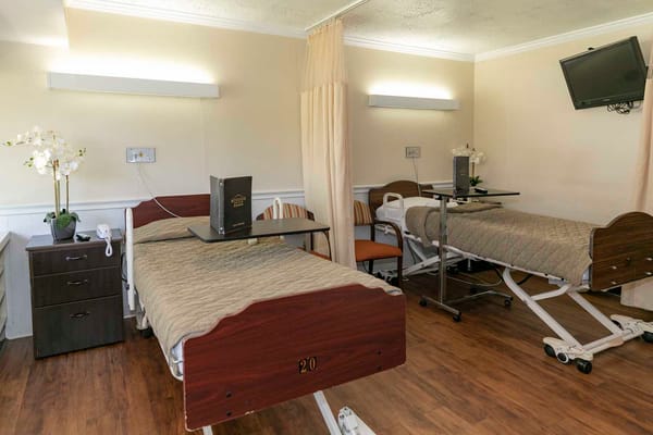 Shared living space with hospital beds and fixtures