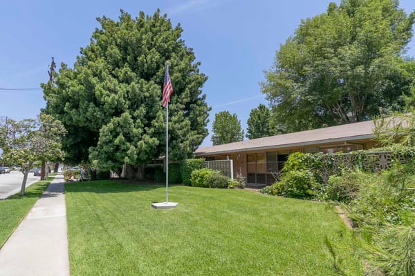 Exterior view of the Mission Care Center with landscaping