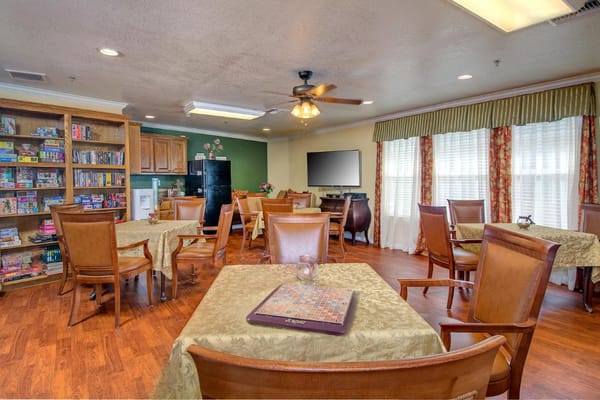 Common area with tables and games at Heritage Place of Boerne