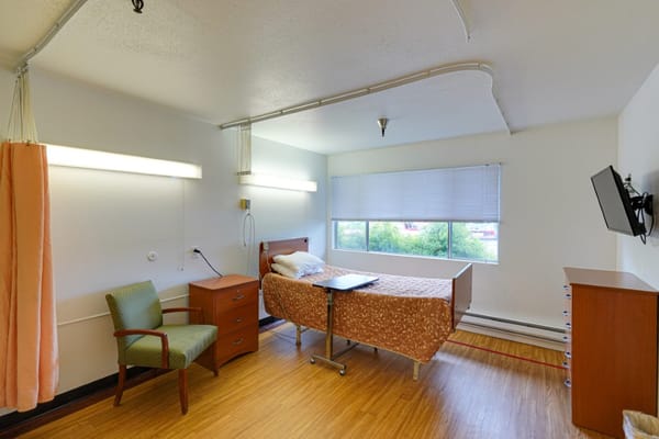 A resident room with a bed and view